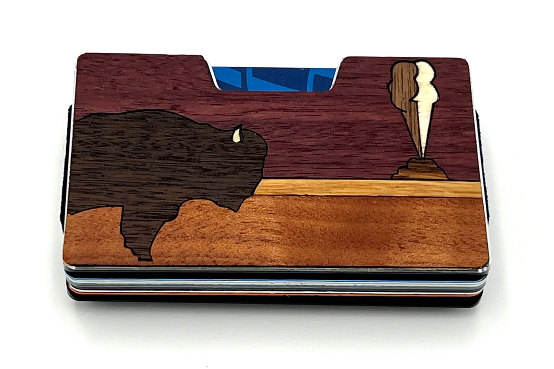 Wood inlay wallet with a bison and erupting geyser on purpleheart