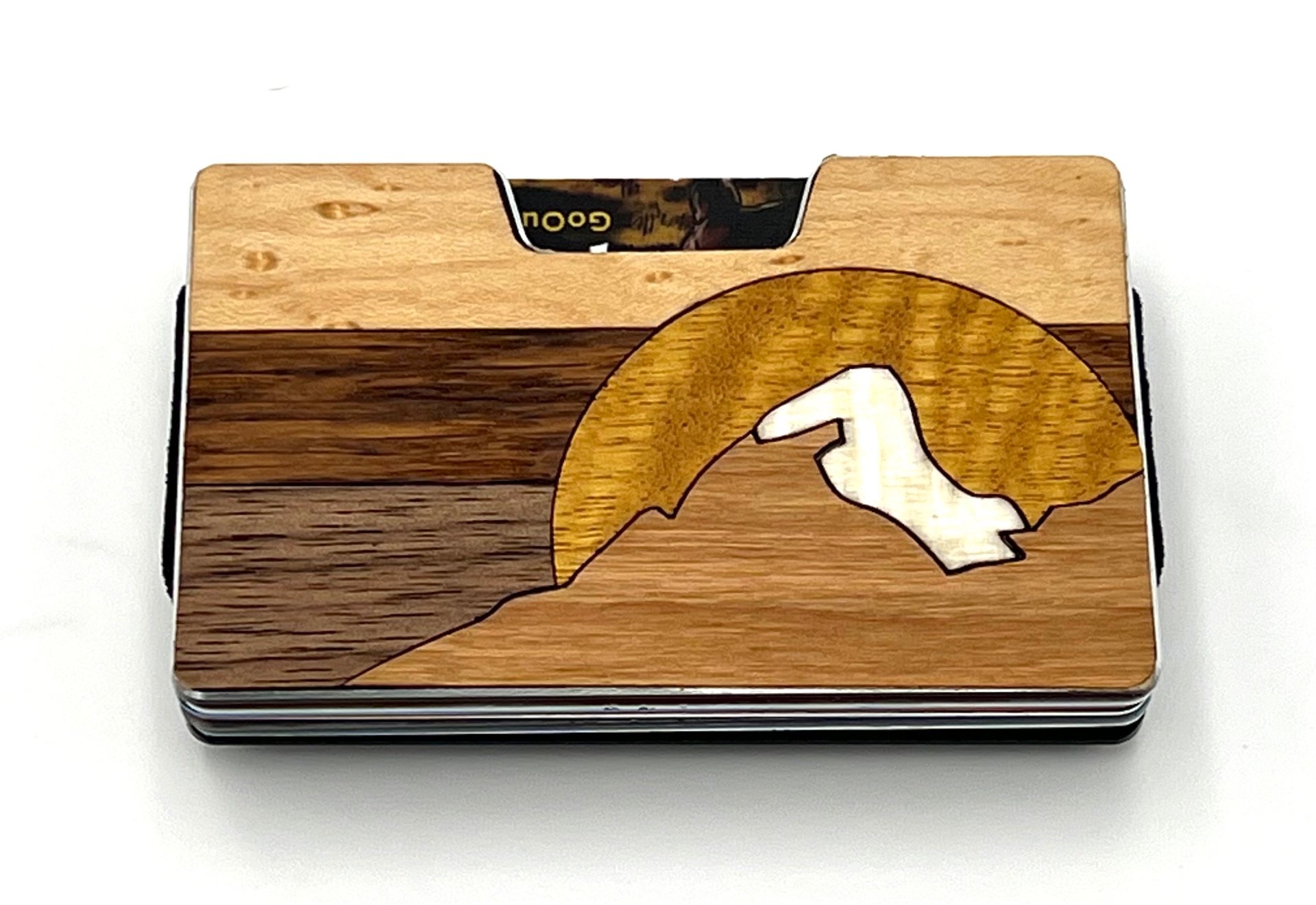 Wood inlay wallet with a mountain range inside a golden sun