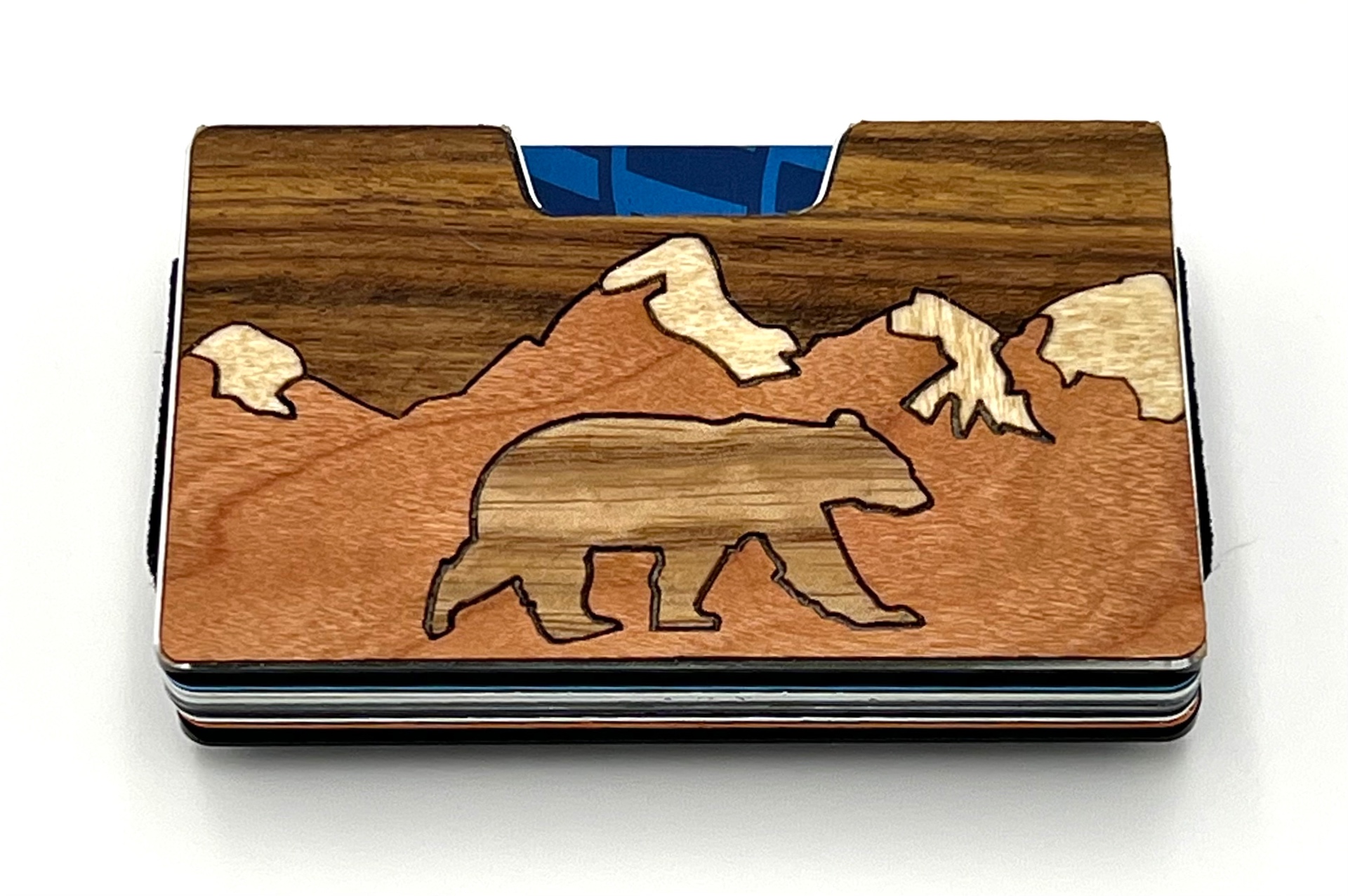 Wood inlay wallet with a walking bear and snow-capped mountains