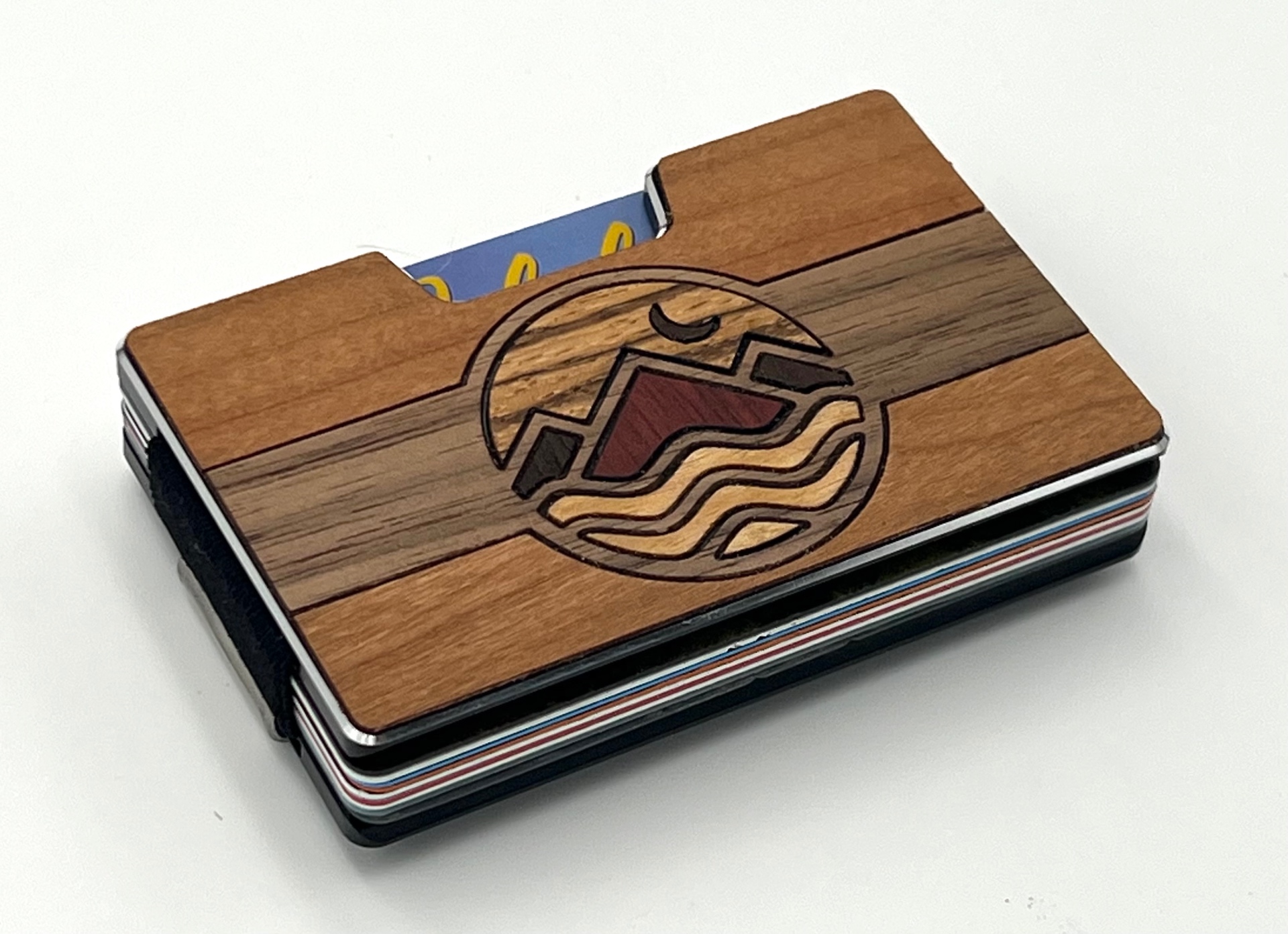 Angled view of the circular mountain waters wood inlay wallet