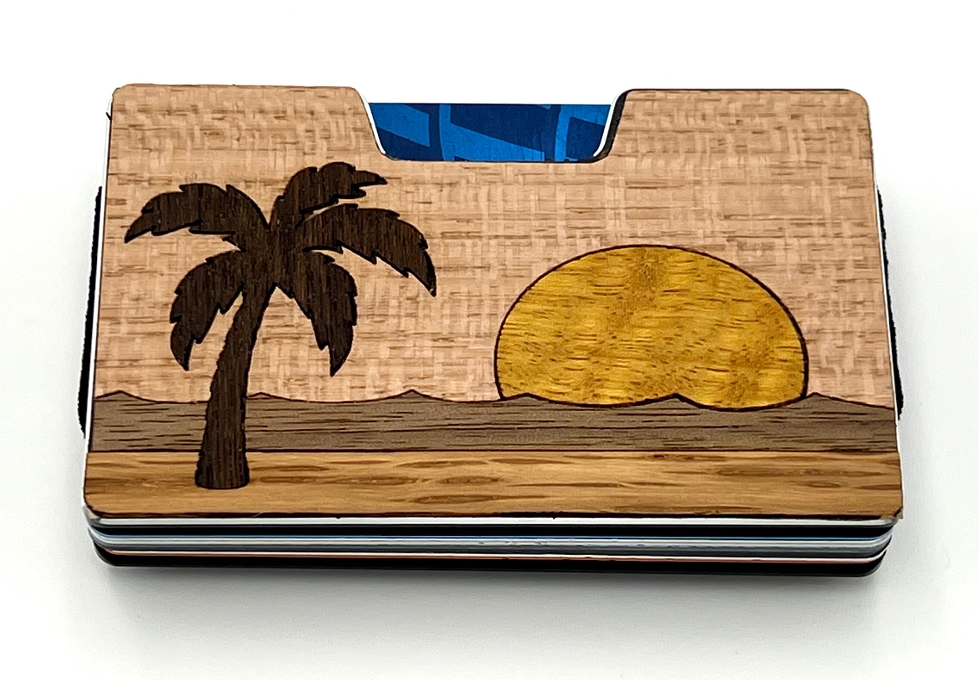 Wood inlay wallet with a palm tree and setting sun over water